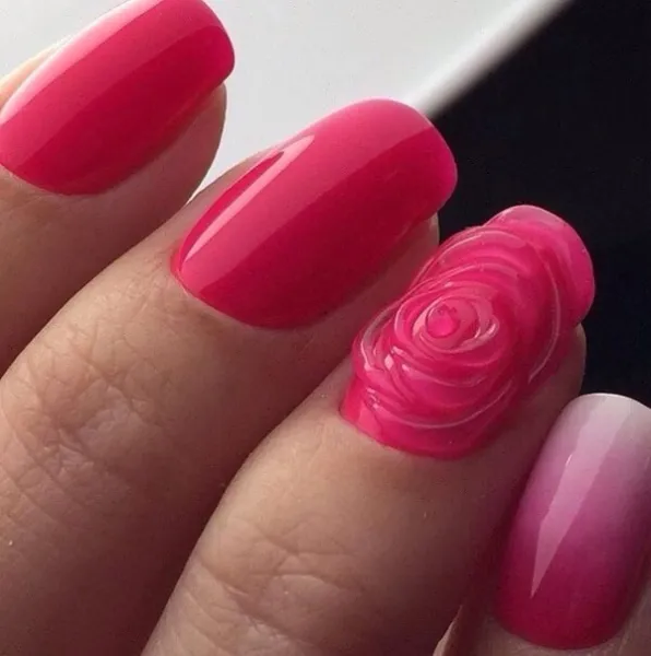 Яскравий рожевий максималізм: Овальні нігті з омбре та 3D квітами