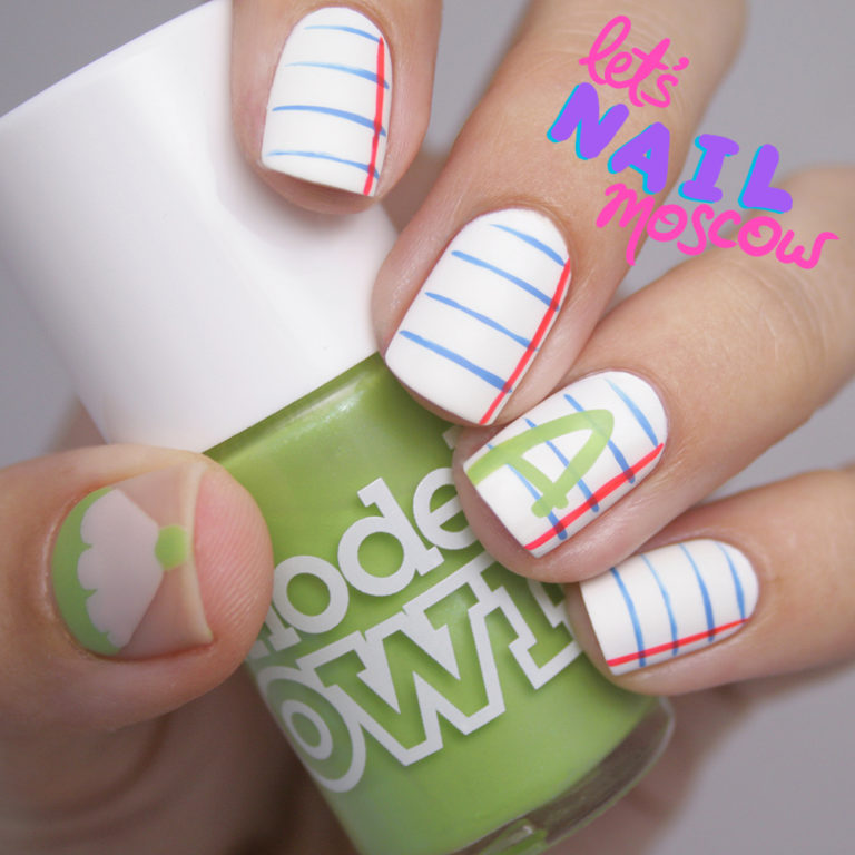 Матовий білий манікюр з синьою геометрією ручного розпису