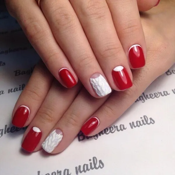 Ефектний червоний френч з білим 3D візерунком на овальних нігтях