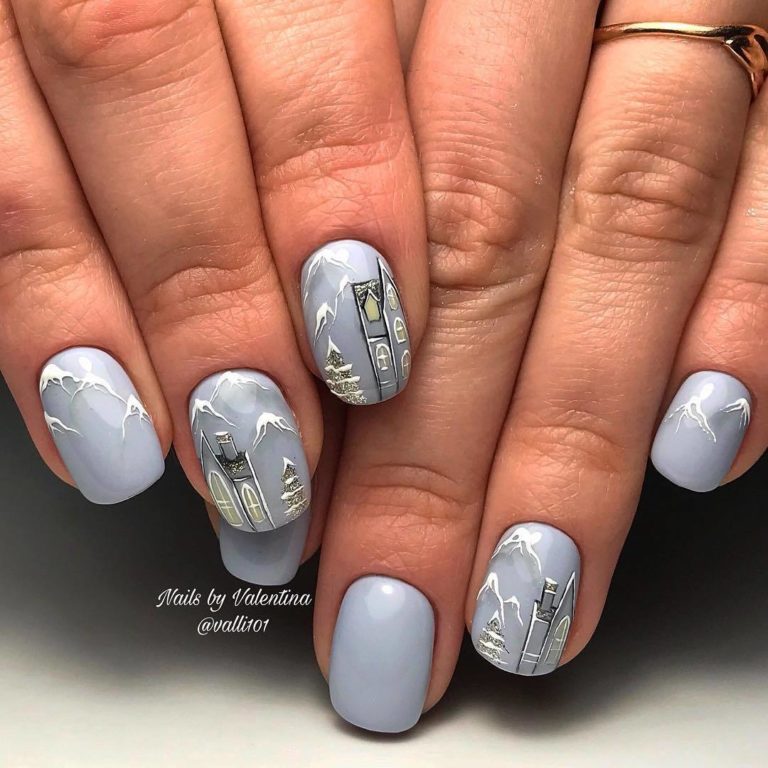 Святковий манікюр: синій гель-лак, 3D-візерунки та блискітки